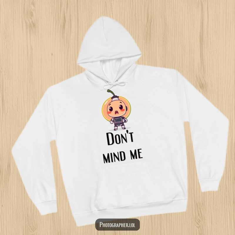 Funny hoodie showing a surprised fruit item being photographed by a tiny robot, embodying a humorous blend of nature and technology.