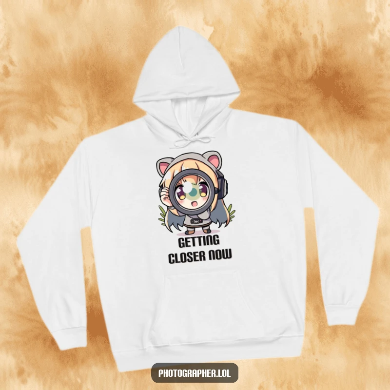 Funny hoodie featuring a character zooming in with a comically exaggerated lens, perfect for photographers.