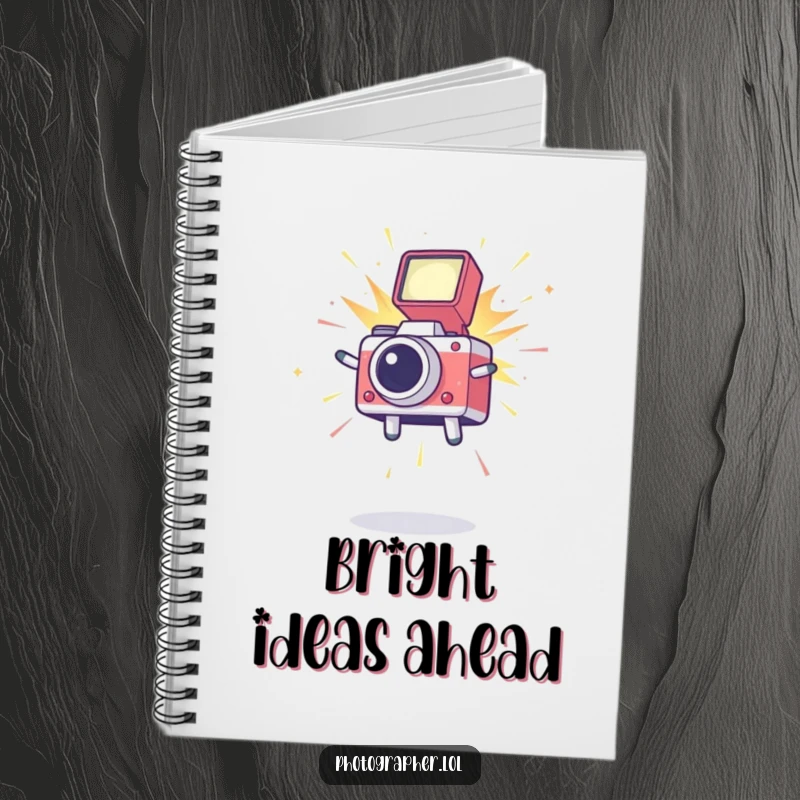 Funny notebook adorned with a leaping icon and a camera flash, perfect for jotting down photography ideas or daily notes.
