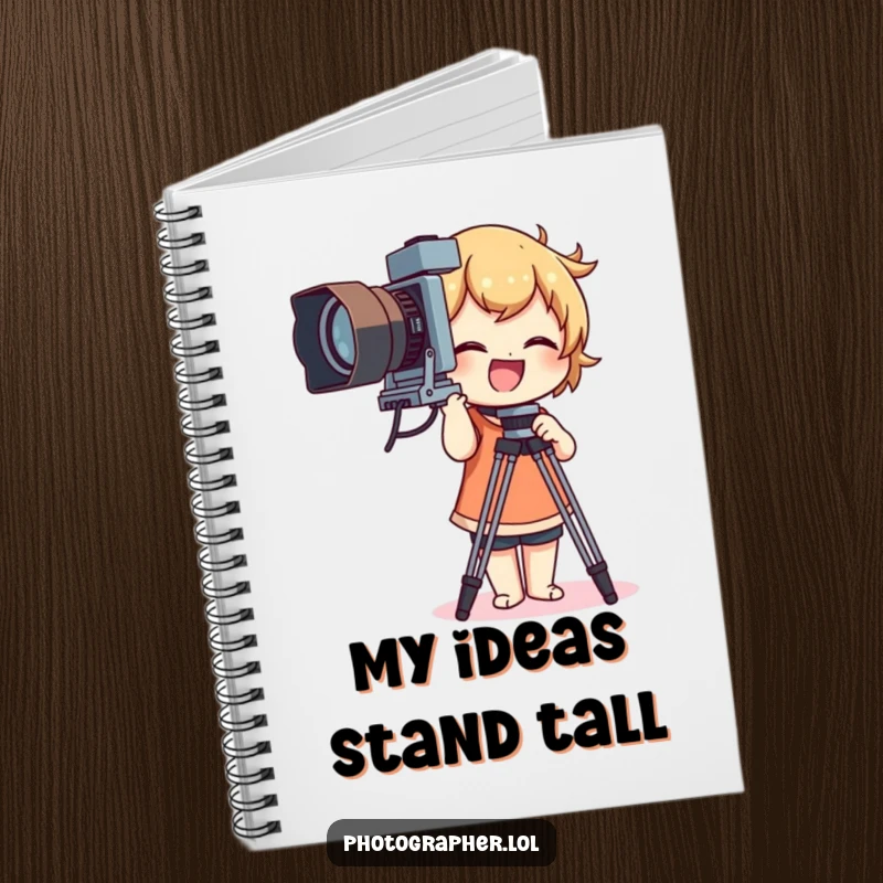 Funny notebook featuring a character giggling while adjusting a large vintage camera tripod, ideal for photo notes.